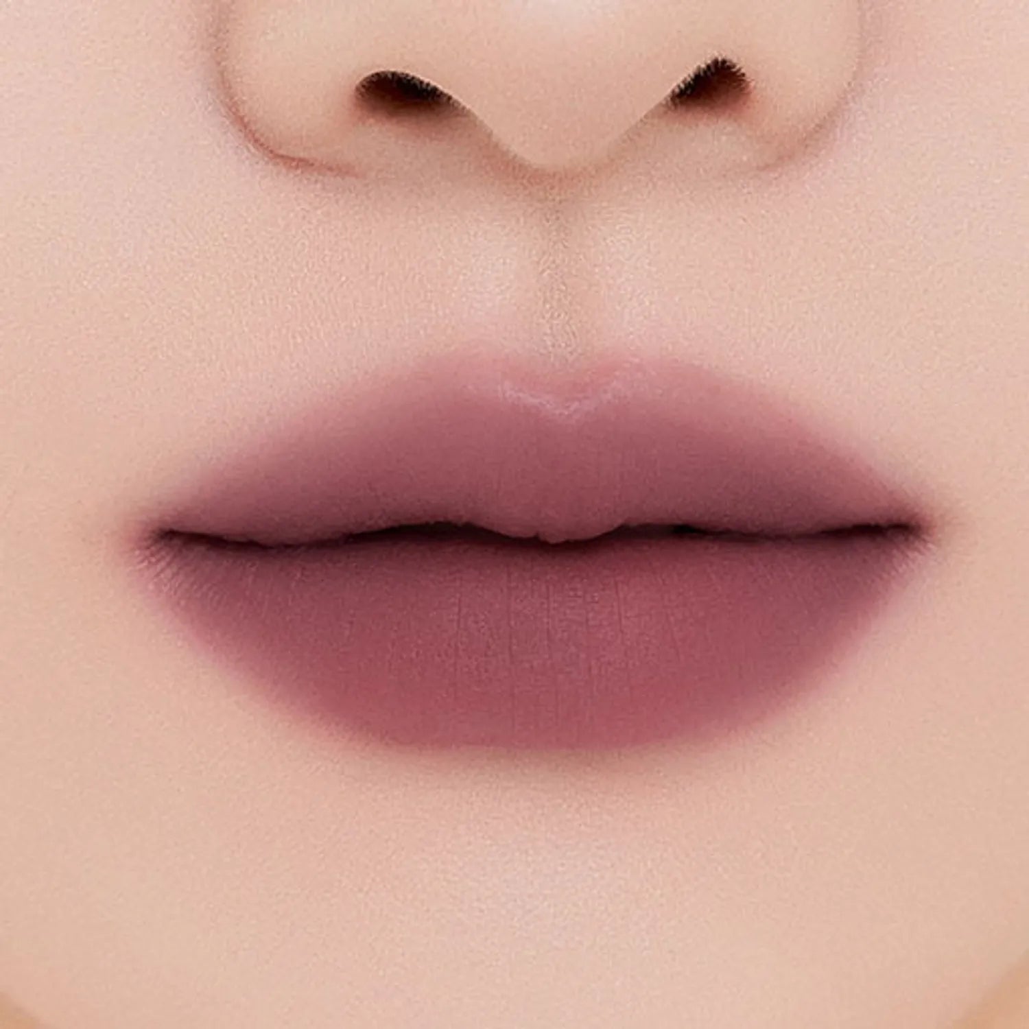 MUZIGAE MANSION Tie Up Cover Tint in sculpted knot tube with soft matte mousse formula. shade coldish mauve