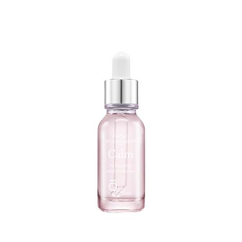 A clear glass ampule bottle with a pink serum visible inside and a dropper tip. The brand's logo is visible on the front, and the bottle has a sleek, elegant design.