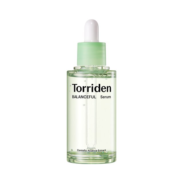 A bottle of Torriden Balanceful Cica Calming Serum with a dropper, primarily green in color.