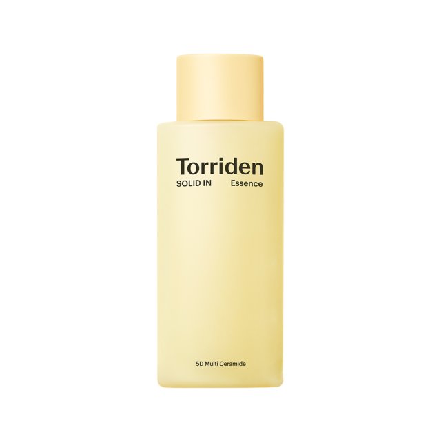 A yellow bottle of Torriden Solid In Ceramide All Day Essence with black text indicating it is a skin care product.