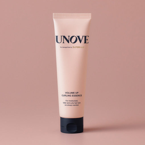 UNOVE Volume Up Curling Essence 147ml in soft beige tube with minimalist design, placed diagonally on a neutral backdrop