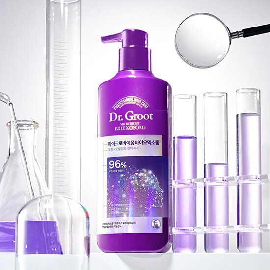 A bottle of Dr.Groot Bio Exosome Scalp Hair Loss Total Care Conditioner with a purple label and pump dispenser.