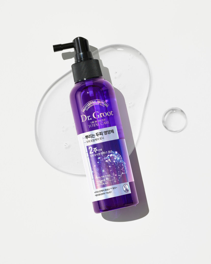 A bottle of Dr.Groot Microbiome Anti-Aging Tonic with a purple label and a black pump.