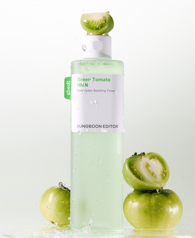 Skincare bottle with green tomatoes on a light background