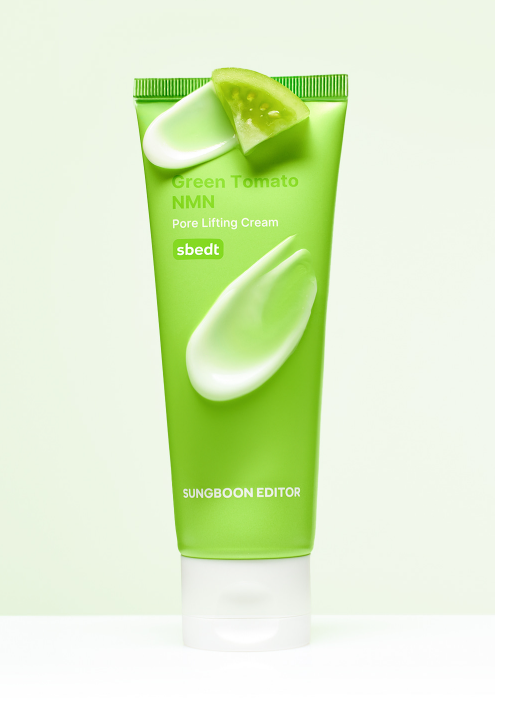 Green tube of skincare cream with a slice of green tomato on a light green background