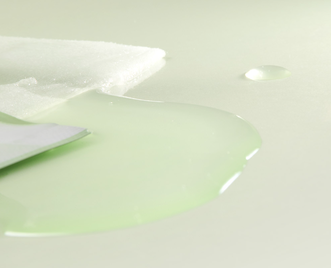 Close-up of a light green liquid on a white background