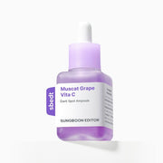 Purple skincare ampoule bottle with dropper on a white background